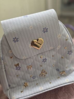 Women’s Light Blue Floral Quilted Backpack with Gold Accents